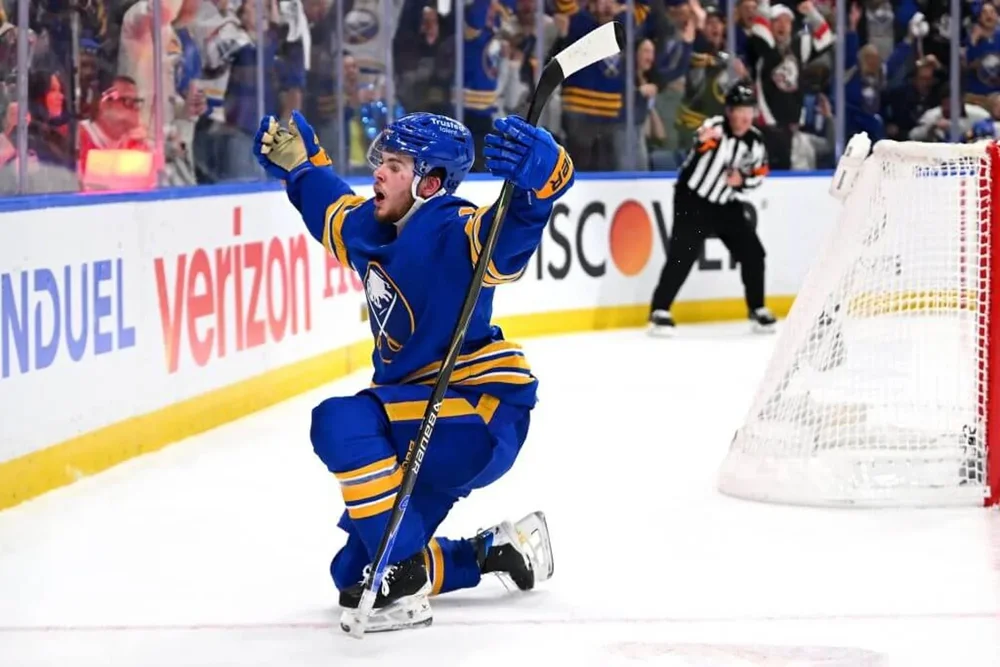 Zach Benson pumps up the crowd from one knee after a goal.