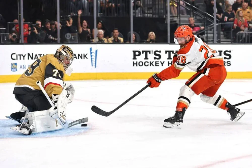 Carter Hart of the Vegas Golden Knights saves a shot attempt by Jeffrey Viel of the Anaheim Ducks
